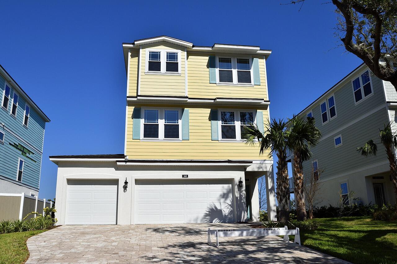 A newly built three-story house with a metal roof