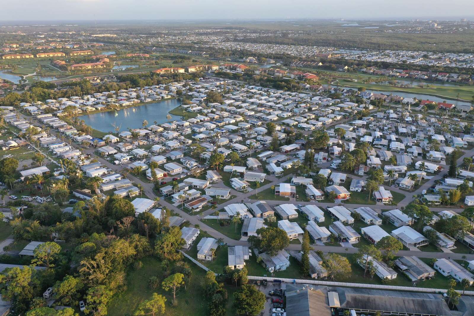 Aerial view of a newer residential subdivision around a lake